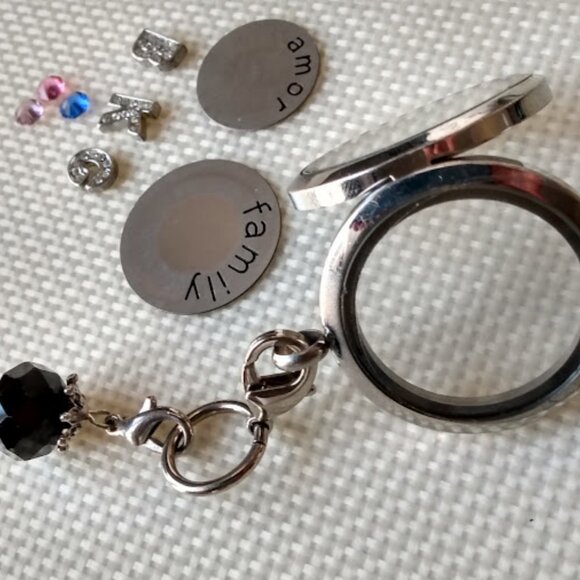 Silver Tone Locket with Black Charm and Trinkets Inside - Picture 2 of 6